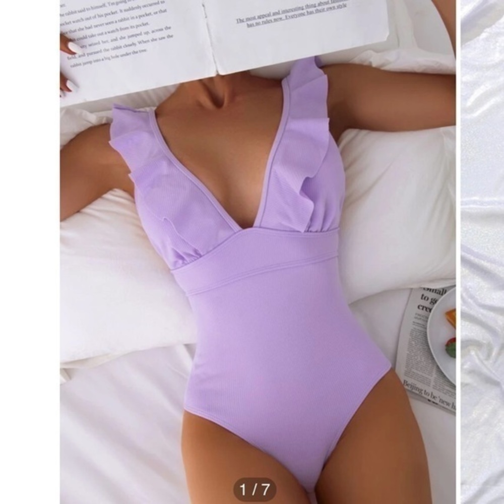 Ruffle one piece swimsuit with ties in the back.